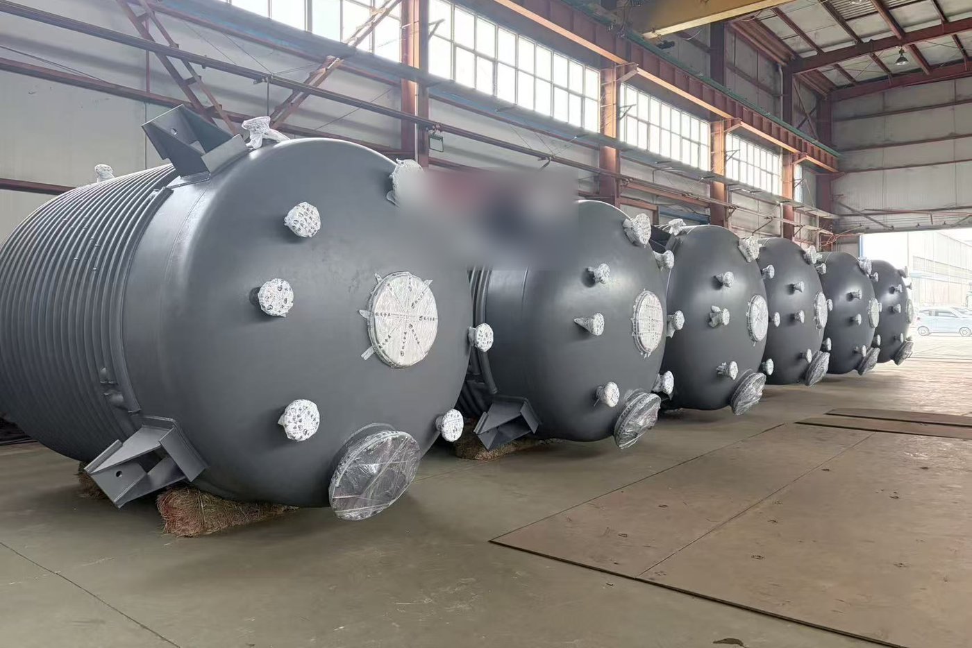 Finished vessels, nozzles masked and wrapped for shipment